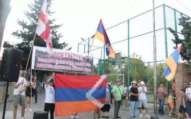 աս