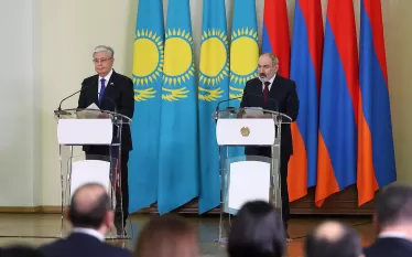 աս