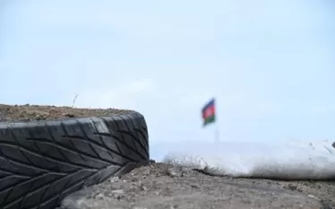 աս